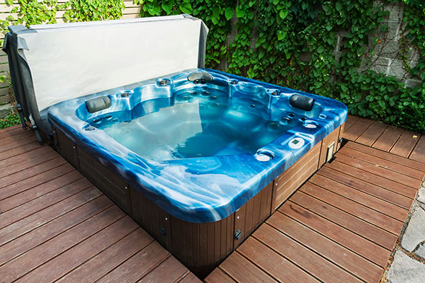 Outdoor hot tub, jacuzzi on the garden.